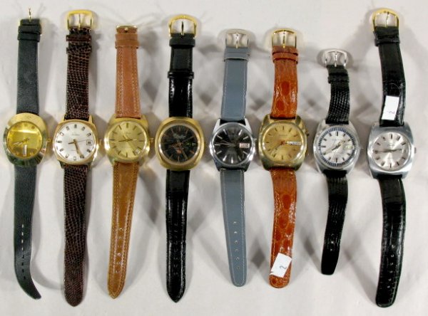 8 Men's Electronic Wrist Watches: 8 Men's Electronic Wrist Watches: 1.) China with day and date. 2.) Tradition with date, Swiss. 3.) Allegro with date at 4/5, no back plate. 4.) Lucien Piccard Sonictron with day and date. 5.) Bellfort