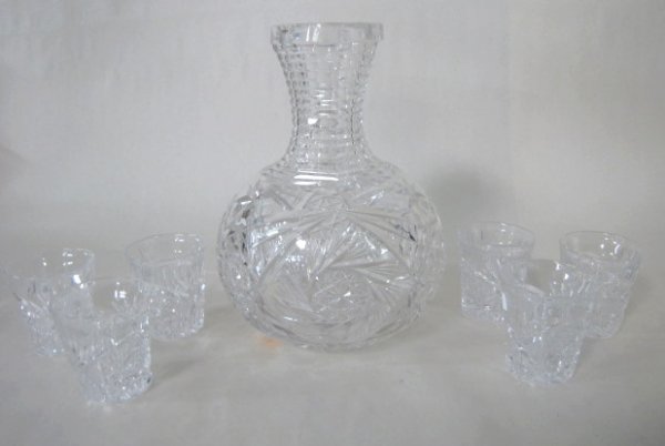 7 Cut Glass Items, Water Bottle & Shot Glasses: 7 Cut Glass Items: 1.) The water bottle has stepped neck, whirling hobstars and large stars with hobstar centers, 7 7/8" tall, no condition problems. 2.) The 6 shot glasses have fan, fine cut, notches
