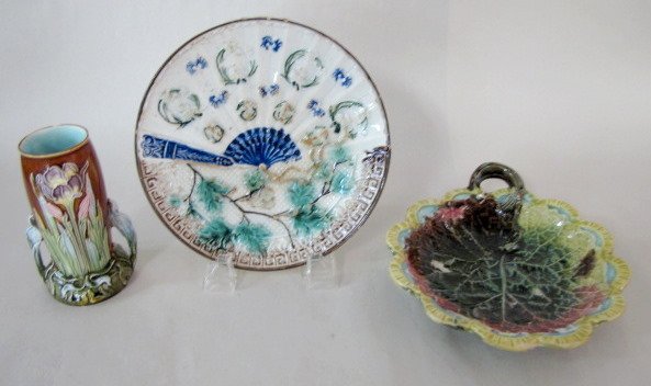 2 Majolica Plates & Art Nouveau Iris Vase: 2 Majolica Plates & Art Nouveau Iris Vase: 1.) The vase has Art Nouveau iris flower designs, numbered 4832, 5 1/4" tall. (Rim chip.) 2.) Shell dish, multi colored yellow, blue, red and green. Unmarked