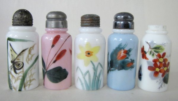 5 Early Decorated Milk Glass Shakers: 5 Early Decorated Milk Glass Shakers: 3 are left white with painted floral designs; 1 has a butterfly also. Another has a blue body with moss rose like décor and original cover. The last is painted p