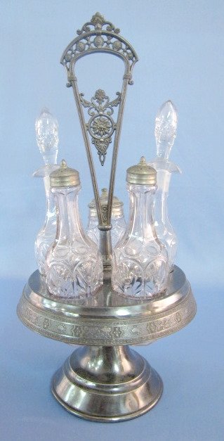 Hall-Miller Co Silverplate 5 Bottle Condiment Set: Hall-Miller Co. Silverplate 5 Bottle Condiment Set: everything matches. (The holder and 3 lids need cleaned. The holder has worn plating.) Holder-15 1/2" tall All items sell As Is, Where Is, no guaran