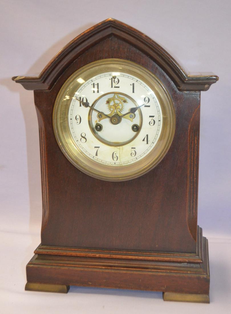 Waterbury Bristol Mahogany Mantel Clock: Waterbury Bristol Mahogany Mantel Clock. Signed open escapement dial has cracks. Beveled glass has dent on upper right corner. 13 1/2" x 9 5/8"