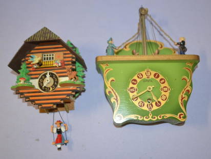 Lot of 2 Vintage Animated Wall & Shelf Clocks: Lot of 2 Vintage Animated Wall & Shelf Clocks. 1.) Heco wood case man & women swinging children. 2.) German swinging lady, animated wood case, signed movement.