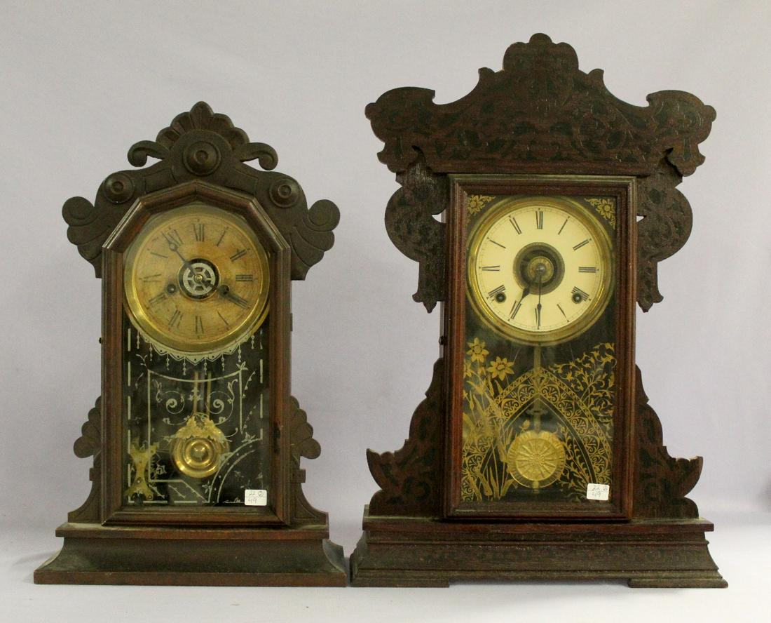 Lot of 2 Wood Case Kitchen Mantles with Alarms: Lot of 2 Wood Case Kitchen Mantles with Alarms. Both have brass movements with alarms, carved cases with good glass, good dials. 22 3/4"x14 1/2" & 20"x13"