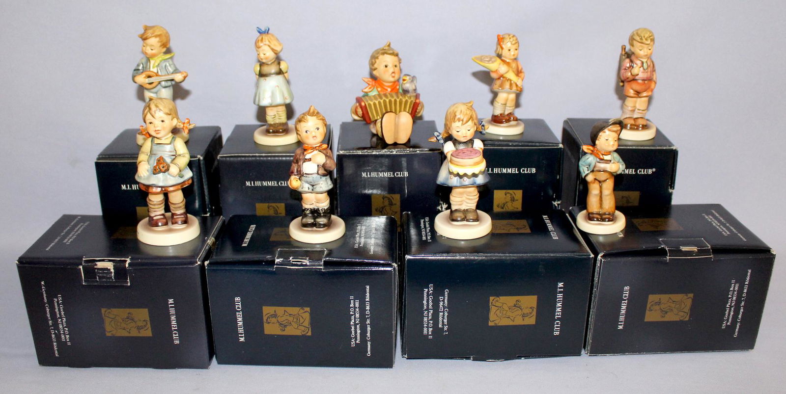 9 Goebel Hummel Club Figurines in Original Boxes. 1.): 9 Goebel Hummel Club Figurines in Original Boxes. 1.) Lets Sing, #110 2.) Little Troubadour, #101. 3.) A Sweet Offering, #549 3/0. 4.) Sweet As Can Be, #541. 5.) Cheeky Fellow, #172. 6.) Two Hands, On