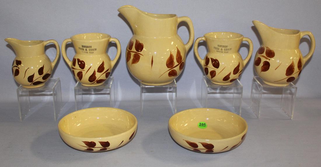 7 Watt Pottery Autumn Foliage Collectibles. 1.): 7 Watt Pottery Autumn Foliage Collectibles. 1.) creamer, #62. 2.) 2 sugars, #98 (No lid). Advertising "Unkrich Feed & Grain Swifts Feed." 3.) 2 Bakers, #94 4.) Creamer, #16 5.) Creamer, #15. Tallest 6
