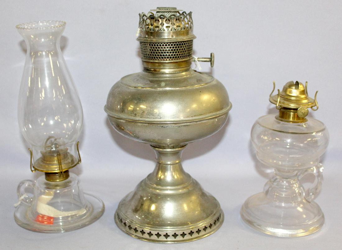 3 Antique Kerosene Oil Lamps, Rayo & Glass. 1.): 3 Antique Kerosene Oil Lamps, Rayo & Glass. 1.) Silvered metal Ray, marked burners, no chimney, finish wear. 2.) Fotted finger lamp with P&A burner; no chimney. 3.) Inverted cup & saucer finger lamp; 