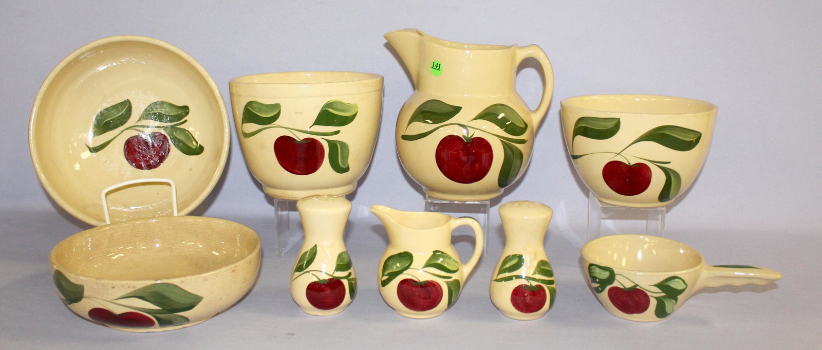 8 Watt Pottery Apple Tableware Collectibles, 3 Leaf.: 8 Watt Pottery Apple Tableware Collectibles, 3 Leaf. 1.) Ice lip pitcher, no number on the bottom. 2.) French handle casserole, #18 No lid. Hairline. 3.) Hour glass shakers, S&P; #117 & #118. 4.) Ice 