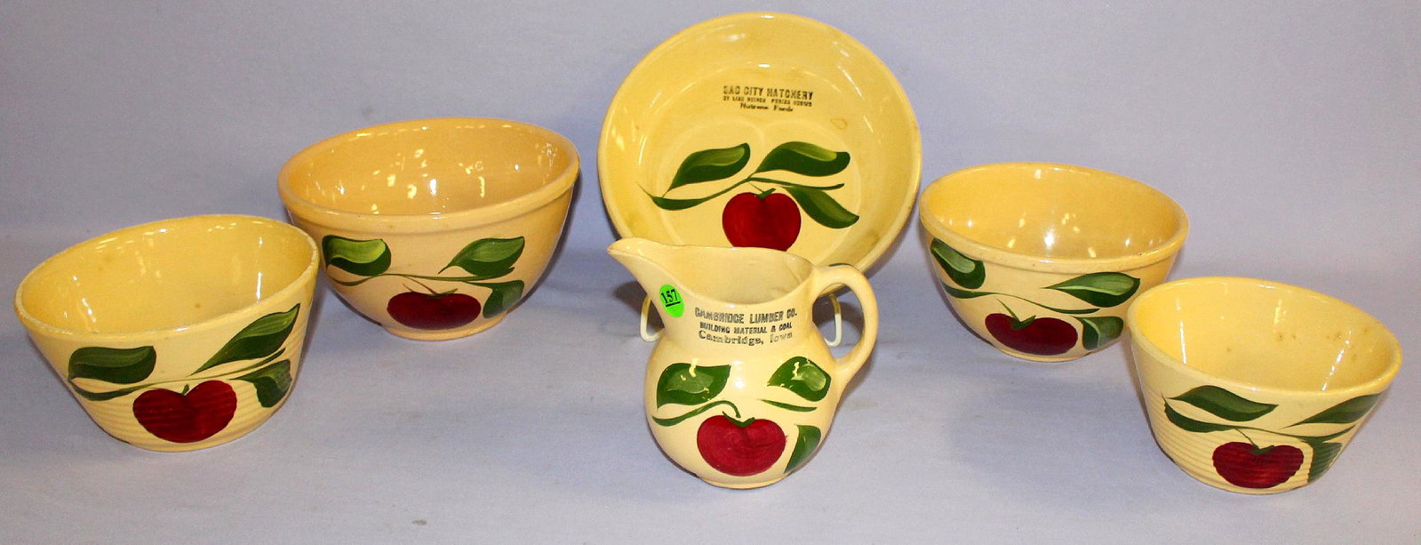 6 Watt Pottery Apple Dinnerware, 3 Leaf. 1.) Cream: 6 Watt Pottery Apple Dinnerware, 3 Leaf. 1.) Cream pitcher, advertising "Cambridge Lumber Co. Building Material & Coal Cambridge, Iowa" #15. 2.) Piedish, advertising "Sac City Hatchery Hy Line Chicks,