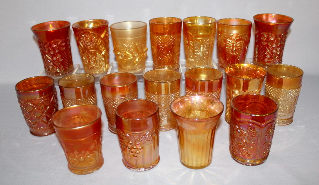 18 Marigold Carnival Glass Tumblers. 1.) 6 Lattice &: 18 Marigold Carnival Glass Tumblers. 1.) 6 Lattice & flour pattern. 2.) 3 lily & flower. 3.) 9 assorted, 1 of each butterfly & palm; butterfly & berry; arch & grape; water lily & cattail; flour and wh