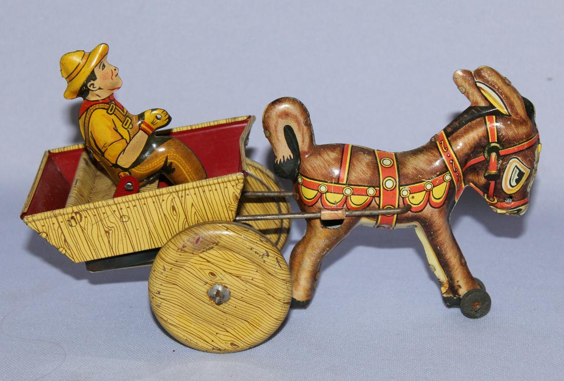 Marx Tin Litho Key Wind Donkey & Cart Toy. Marked; set: Marx Tin Litho Key Wind Donkey & Cart Toy. Marked; set key; working. (Donkey has some rusty areas on him.) 5" T