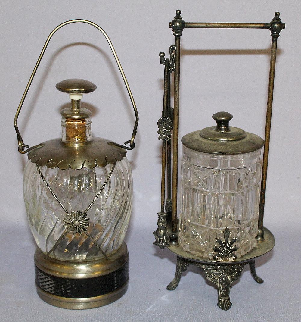 Antique Pickle Castor & Muskal Liuquor Jar. 1.) Clear: Antique Pickle Castor & Muskal Liuquor Jar. 1.) Clear block & cross pickle jar; in a James Tuft silver plate frame with lid and tongs. 2.) Clear twisted panel bulbous bottle on a musical base; bottle