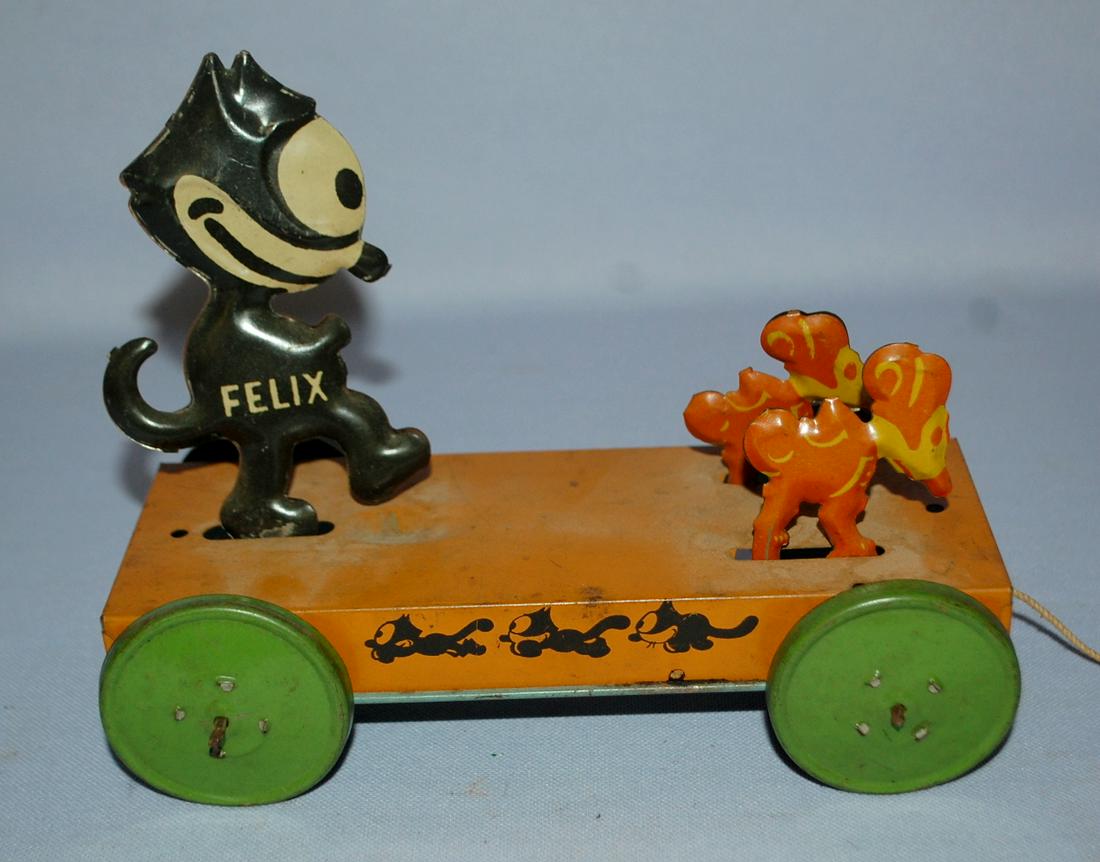Antique Tin Pull Toy Felix The Cat Chasing Mice: Marked: Antique Tin Pull Toy Felix The Cat Chasing Mice: Marked Nifty-Felix-Reg U.S. Pat. Off. Copyright by Pat Sullivan. All original. (Shows use, the platform top has scattered rust spot, and is kind of dir