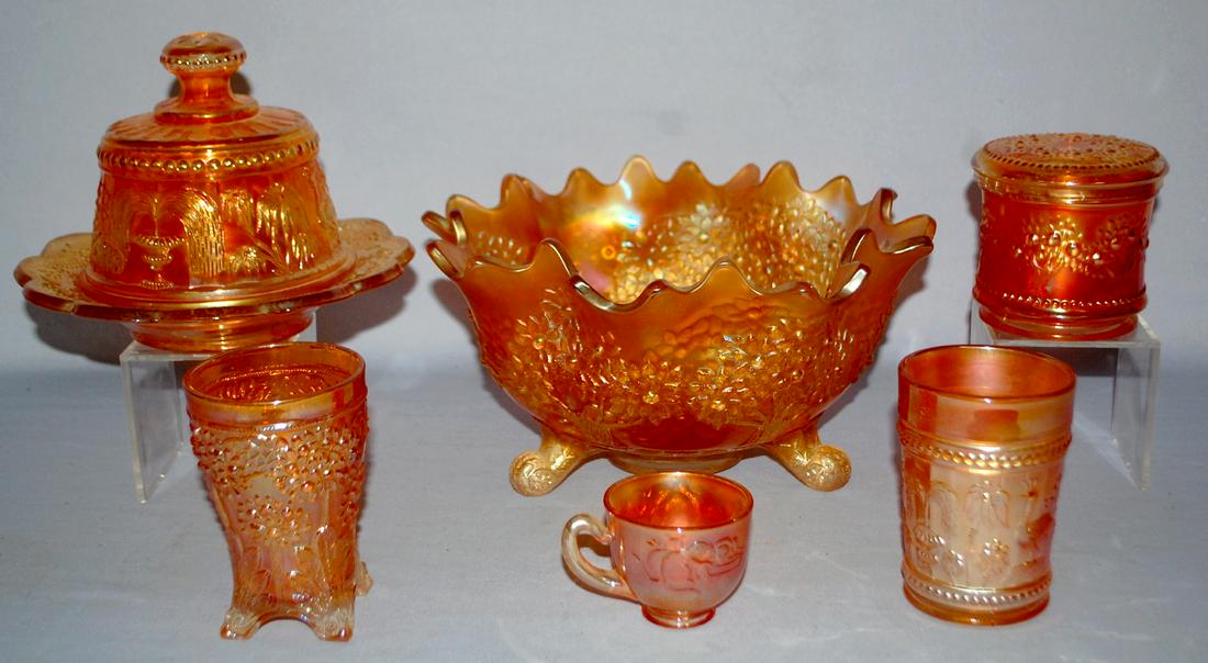 6 Marigold Carnival Glass Tableware Collectibles. 1.): 6 Marigold Carnival Glass Tableware Collectibles. 1.) Orange Tree Center Bowl. 2.) Signed Northwood Peacock fount butter dish. 3.) Orange tree tumbler. 4.) Orange tree dresser jar with lid. 5.) Peacoc