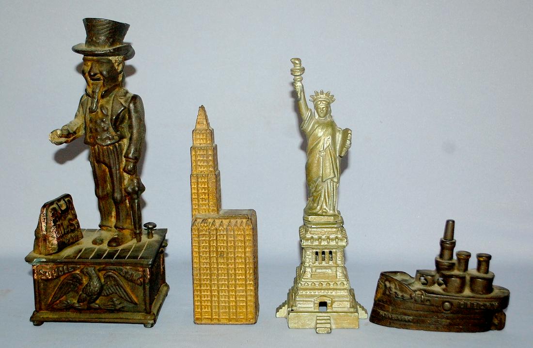 4 Vintage Cast Iron Banks. 1.) Woodworth Building;: 4 Vintage Cast Iron Banks. 1.) Woodworth Building; Kenton 2.) Statue of Liberty; Wing or Kenton. 3.) Oregon; J&E Stevens, no paint. 4.) Mechanicle Uncle Sam bank; works; no paint.