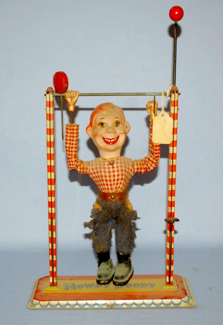 Tin Litho Howdy Doody Acrobat Toy: made of tin, cloth: Tin Litho Howdy Doody Acrobat Toy: made of tin, cloth and other materials; made in West Germany by Arnold, imported to Novelty Toy Associates. In good working condition. 12 1/2" T x 9 1/2". (His jeans