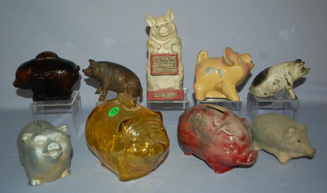 9 Vintage Piggy Still Banks. 1.) Amber marked Anchor: 9 Vintage Piggy Still Banks. 1.) Amber marked Anchor Hocking. 2.) Brown embossed "Piggy Bank" 3.) Ceramic pig marked W. Dawson, 10 (looks like it may have been in a fire. 4.) Cast iron "Thrifty The Wi