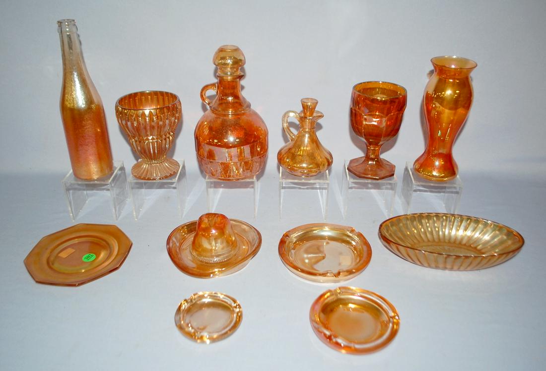 10 Marigold Colored Carnival Glass Collectibles: 1.): 10 Marigold Colored Carnival Glass Collectibles: 1.) Decanter jug, marigold wash. 2.) Zipper panel vase. 3.) Paneled goblet. 4.) Plain vase. 5.) Canada Ginger Ale textured soda bottle. 6.) Plain hexag