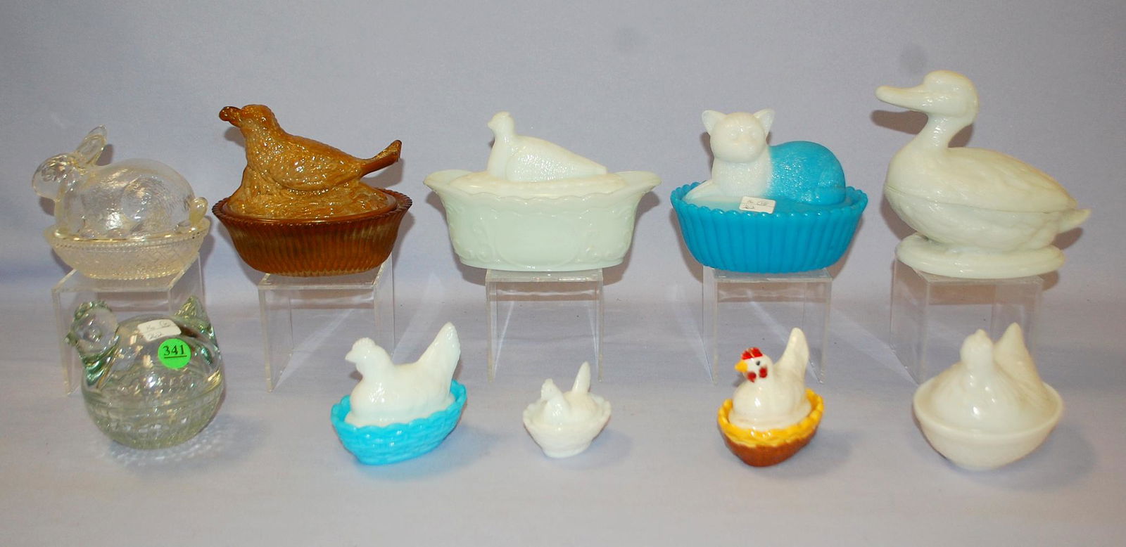 10 Glass Animals on Nest or Basket, Hens, Duck, Cat +:: 10 Glass Animals on Nest or Basket, Hens, Duck, Cat +: 1.) Caramel slag Bird with Berry. 2.) Blue & white, cat on basket. 3.) Opaque glass pheasant on bowl. 4.) Opaque glass figural duck. 5.) Opaque g