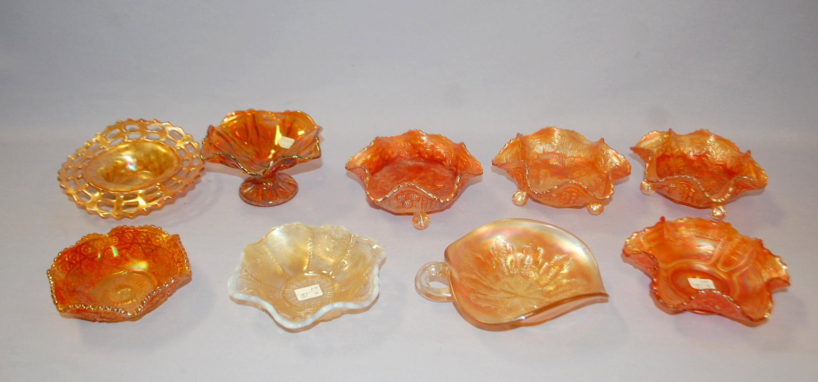 9 Marigold and Peach Opal Carnival Glass Collectibles:: 9 Marigold and Peach Opal Carnival Glass Collectibles: Marigold Include 1.) Basket weave Openwork bowl. 2.) Dugan Leaf pattern nappy. 3.) 3 Fenton Panther bowls. 4.) Fenton Sailboat pattern bowl. 5.) 