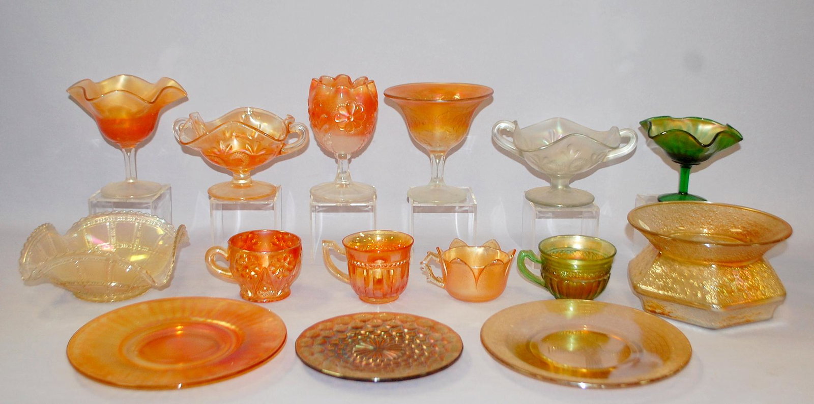 15 Vintage Carnival Glass Collectibles: 1.) 2 Fenton: 15 Vintage Carnival Glass Collectibles: 1.) 2 Fenton Peacock tail footed and handled compotes, 1 marigold, 1 white. 2.) Peacock footed compote, marigold. 3.) Rayed footed jelly compote. 4.) Rosette an