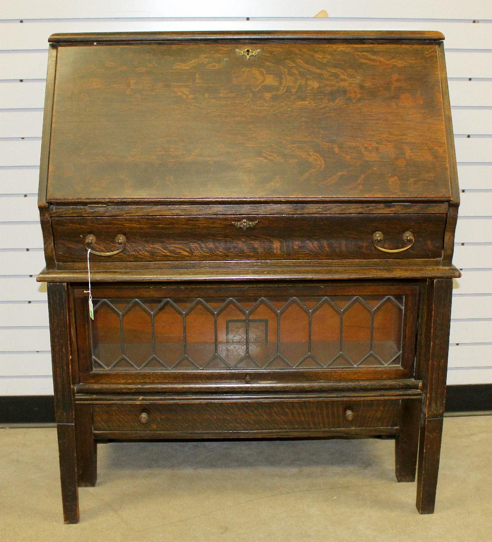 Antique Globe Wernicke Sectional Desk/Bookcase: Antique Globe Wernicke Sectional Desk/Bookcase: drop front desk has 12 pigeon holes, 2 small drawers and is stamped Globe Wernicke; there is a long drawer under the desk; leaded glass lift top drawer 