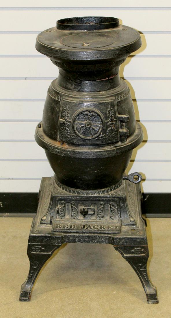 Antique Cast Iron No. 8 Red Jacket Coal Heating Stove: Antique Cast Iron No. 8 Red Jacket Coal Heating Stove: embossed No. 8, Red Jacket with some decoration; appears complete except for the stove pipe. 30 1/2" T x 16 1/2" square. This item ships F.O.B.
