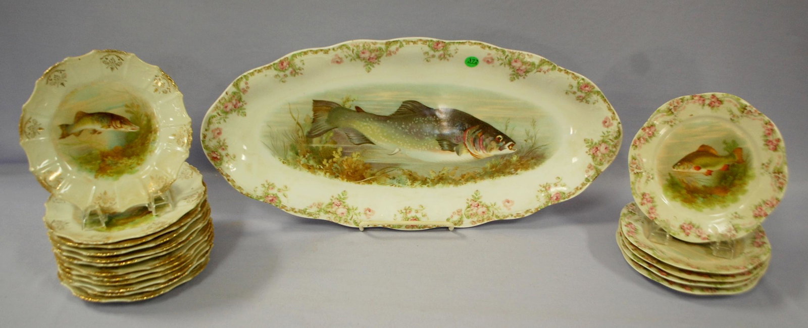 6 Piece Z.S. Co. Mignon Fish Service Set + 12 Other: 6 Piece Z.S. Co. Mignon Fish Service Set + 12 Other: Mignon includes the platter and 5 plates decorated with various fish. There is a set of 12 plates that do not match the Mignon set but have the sam