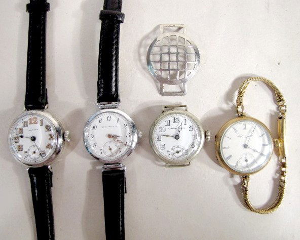4 Wrist Watches & Screen Cover for Military Watch: 4 Wrist Watches & 1 Metal Screen Cover: 1.) Elgin 20 yr case with fancy DMK, no.6838323, 16J movement. Marked 16 Jewels. 0 or 00 size. Running at this time. 2.) Rexmont's Prima, base metal with white