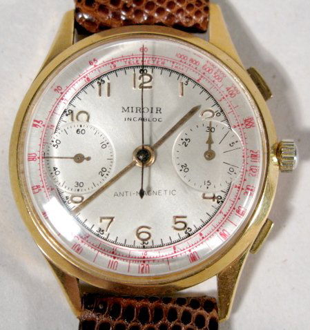 18K Miroir Incabloc Chronograph Wrist Watch: 18K Miroir Incabloc Chronograph Wrist Watch: Antimagnet, 17J Swiss movement. Case back numbered 1010, 24 & 156. It has a silver dial with gold hands and numbers, with red telemeter. Running at this ti