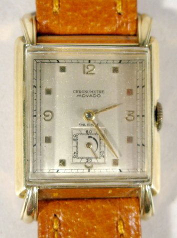 Movado 17J 14K Gold Chronometre Wrist Watch: Movado 17J 14K Gold Chronometre Wrist Watch: Swiss, unadjusted 17J movement. Silver dial, gold hands, numbers and markers with square seconds dial. Running at this time. All items sell As Is, Where Is