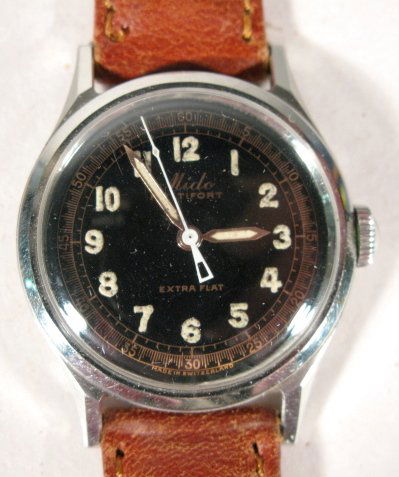 Mido Multifort Extra Flat Wrist Watch: Mido Multifort Extra Flat Wrist Watch: made of rustless steel with a black dial, luminous hands and numbers with copper colored seconds ring. Not opened. Running at this time. (The crystal has small s