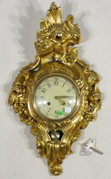 Y. Westerstrands Gilt Wood Wall Clock: Y. Westerstrands Gilt Wood Wall Clock: 9953A is on the back plate. It has a time and bell striking movement with a 6 1/2" convex dial. The case is floral and scroll carved. Not hung or tested at this