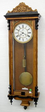 1 Weight Carved Vienna Regulator: 1 Weight Carved Top Vienna Regulator: 8" dial with seconds bit. The case is partially ebonized. (Not running. The spring backwinds and lets the weight free fall. The dial is fractured.) 45" All items