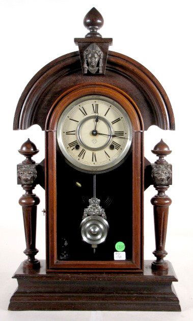 Ansonia King, Walnut Mantel Clock: Ansonia King, Walnut Mantel Clock: 8 day time with half hour gong striking movement and 6" dial. (The dial has minor discoloration. A sliver of wood is missing from the case's lower left side.) 23" x