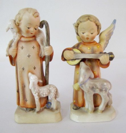 2 Hummel Figurines: Good Shepherd, Angel Serenade: 2 Hummel Figurines: 1.) No. 42/0 Good Shepherd, stamped and impressed No.1 trademark. 6 1/8" tall, no condition problems. 2.) No.83 Angel Serenade, has trademark 2. 5 7/8" tall (Both wing tips are chi