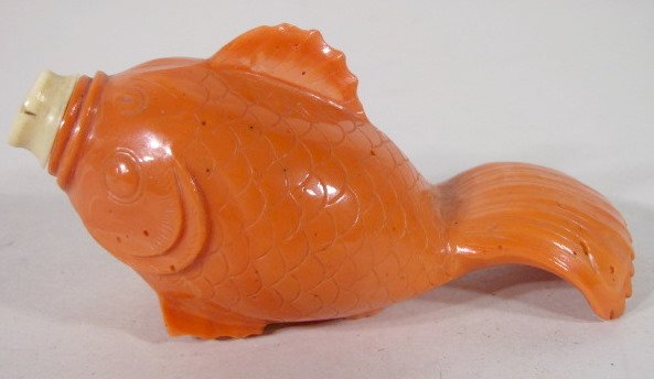 Red Coral Fish Shape Snuff Bottle: Red Coral Fish Shape Snuff Bottle: it has nice carved details with ivory cap and spoon. A cork is used as a stopper, all original. The owner's date of acquiring it is 1-31-44. (The dorsal fin has a sm