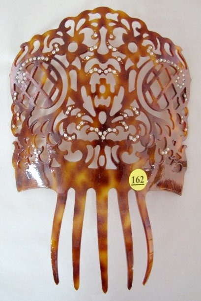Plastic Open Work Tortoise Shell Hair Comb: Plastic Tortoise Shell Hair Comb: open work designs highlighted with rhinestones. No condition problems. 9 3/4" x 7" All items sell As Is, Where Is, no guarantees of any kind. We accept Mastercard & V