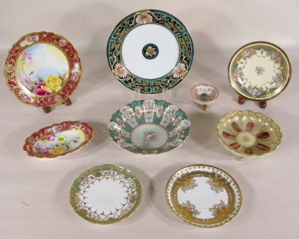 8 Nippon Decorated Pieces & 1 Footed Salt: 8 Nippon Pieces & 1 Footed Salt: 1.) The salt is pink and gold with floral paintings. Marked G889. 1 3/8" x 3" 2.) Nippon footed dish, gold scroll work on off white and maroon ground. Blue leaf mark. 