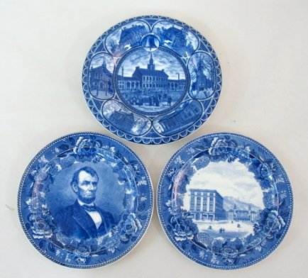 3 Flow Blue Collector's Plates- Abe Lincoln, +: 3 Flow Blue Collector's Plates: 1.) Has Abraham Lincoln in the center with a border design of flowers. Made by Wedgwood Etruria. 9 3/4" wide (Scratched from use.) 2.) Has a view of "The Antlers" build