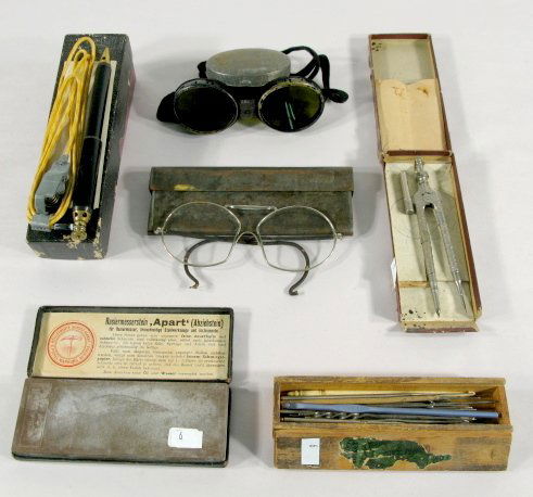 6 Items: Safety Glasses, Sharpening Stone & More: 6 Items: 1.) Pair of darkened safety glasses in a tin case, elastic strap for holding in place. 2.) Pair of oddly shaped glasses in a tin metal box. 3.) Kunstein-Fabrik C. Picket sharpening stone in b