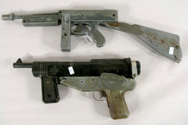 2 Toy Guns: Mattel Cap Gun & USA Machine Gun: 2 Toy Guns: 1.) Mattel Toymaker's Cap Gun #2,729,011; metal and plastic. (Shows wear.) 13" long 2.) USA Tin Toy Machine Gun (Paint is worn off.) 20" long All items sell As Is, Where Is, no guarantees