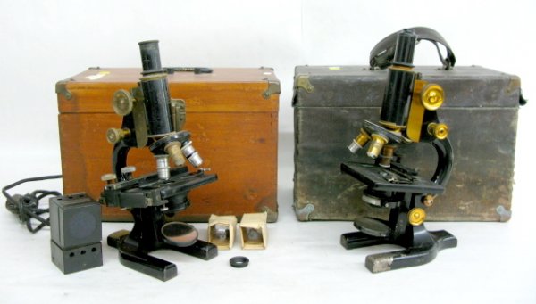 2 Michigan Biological Supply Co. Microscopes: 2 Michigan Biological Supply Co. Microscopes: Spencer Lens Co. #109473 and 97385. With accessories. Both in wood cases, one cloth covered. (Some corrosion, 1 mirror cracked.) 9 1/2" x 13 1/2" All item