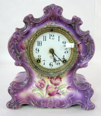 Ansonia Waco China Mantle Clock: Ansonia Waco China Mantle Clock: with purple tulips decoration; porcelain dial; time and strike (Inside rim chip in glass. Running condition not known.) 11 1/2" x 10" All items sell As Is, Where Is, n