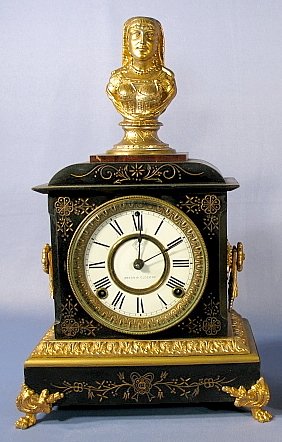Ansonia Enameled Iron Case Clock: Ansonia Enameled Iron Case Clock: marble inset; time and strike (No back cover) 17 1/2" x 10" All items sell As Is, Where Is, no guarantees of any kind. We accept Mastercard & Visa, no paypal, no pers