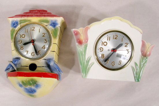 2 Sessions Pottery Cased Electric Clocks: 2 Sessions Pottery Cased Electric Clocks: 1.) The clock is house shaped with a pink tulip at each end; the tulips are open as for vases or pen holders; Model W on the back of movement; Sessions on the