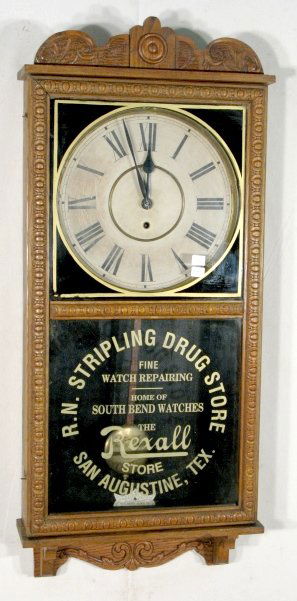 Waterbury Time Only "Crane" Wall Clock: Waterbury Time Only "Crane" Wall Clock: pressed oak case with a 12" dial and 8 day time only movement. There is some Rexall Drugstore ads on the lower glass. (The dial is stained; the interior is pain