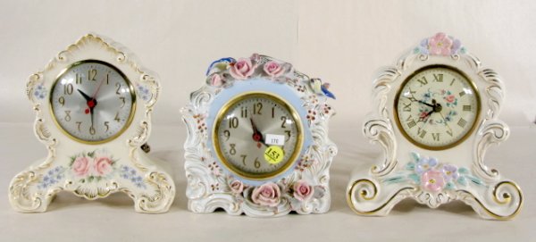 3 Sessions Ceramic Electric Clocks: 3 Sessions Ceramic Electric Clocks: 1.) Model W, label reads Johnson China. Floral and gold trim. 7 1/2" 2.) Model W, Occupied Japan with applied roses and birds, 7" 3.) Model 3A Mold #697, floral and