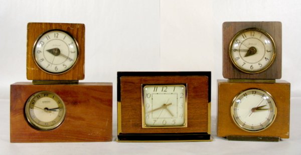 5 Wooden Desk & Alarm Clocks: 5 Wooden Desk & Alarm Clocks: 1.) O.B. McClintock Co. model 15D600 electric desk clock; metal foot and frame, 6" and running at this time 2.) Hammond Synchronous electric Paris alarm; wood rectangular