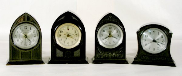 4 Electric Bakelite Alarm Clocks: 4 Electric Bakelite Alarm Clocks: 1.) Hammond A46549 cathedral. (Chip on base.) 7" and running at this time 2.) No.N105716 Chicago Moulded Products case, 5 1/2" 3.) W. Telechron I90763 cathedral, 7 1/